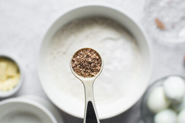 Overhead view of freshly grated Nutmeg in a teaspoon
