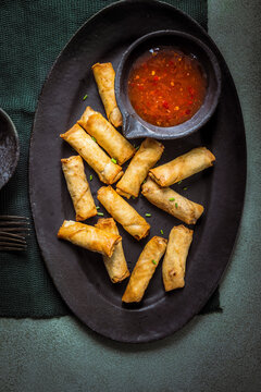  spring rolls served with a spicy dip