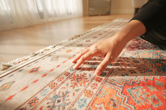  hand touching new home carpet 