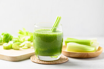 Celery green juice in glass on white background, Healthy drink for detox