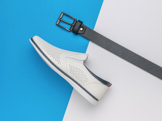 Stylish White Slip-On Shoe and Black Belt on Modern Dual-Tone Background