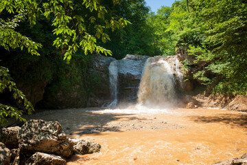 View of the waterfall Noise of the waterfall cascade of the Rufabgo creek on a sunny summer day,...