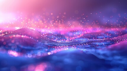 close-up of vibrant, sparkling particles floating over a softly undulating blue and pink surface.