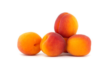 Pile of ripe apricots isolated on a white background