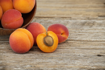 Pile of ripe apricots isolated on rustic wooden table