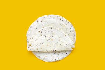 Quinoa tortilla wraps on yellow background