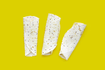 Quinoa tortilla wraps on yellow background