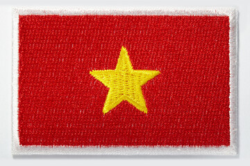 Embroidered emblem of the Vietnamese national flag with one yellow star in the middle of red