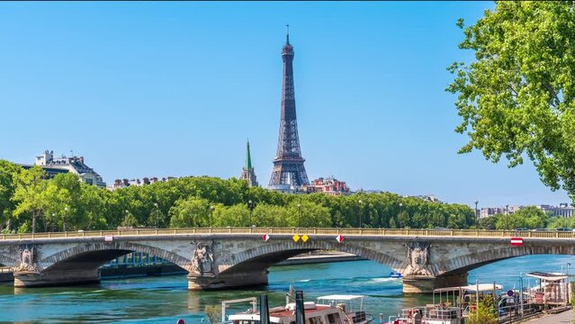 A timelapse of the Eiffel Tower along the river Seine with flyboats passing by with motion blur.Sunny but cloudy spring summer day paris city famous riverside bay tower view bridge timelapse panorama