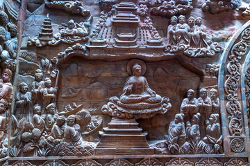 Stone carved base-relief of Ky Lan temple in Ninh Binh, Vietnam. Human figures and floral ornament...