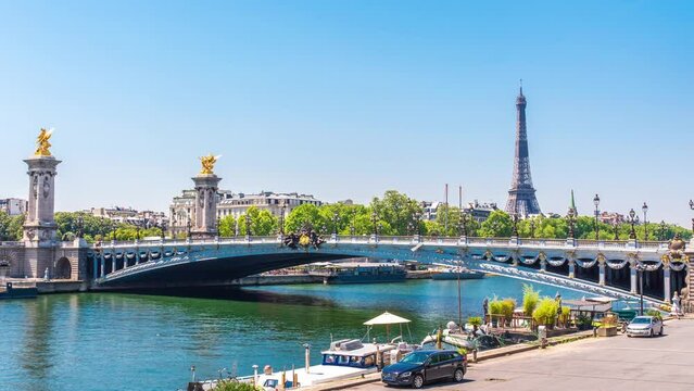 A timelapse of the Eiffel Tower along the river Seine with flyboats passing by with motion blur.Sunny but cloudy spring summer day paris city famous riverside bay tower view bridge timelapse panorama