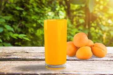 Glass of apricot juice drink on the desk