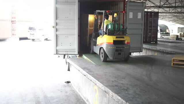 Logistic workers are working at logistic warehouse.