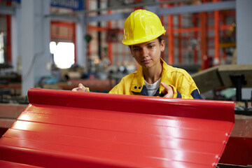 worker or technician holding and checking quality metal sheet in the factory