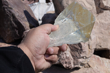 Hand holding translucent stone