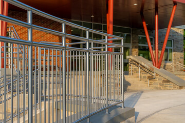 Example of a stainless steel railing along an exterior set of stairs at a public, commercial building.