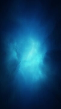 Seamless looping abstract dark blue smoke light vertical copy space animation background.
