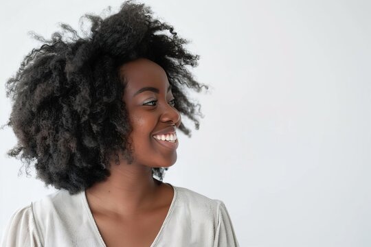 Generate A Professional Headshot Of A Young Woman With Medium-length Hair. She Should Be Smiling And Looking Directly At The Camera. The Background Should Be A Solid Color.