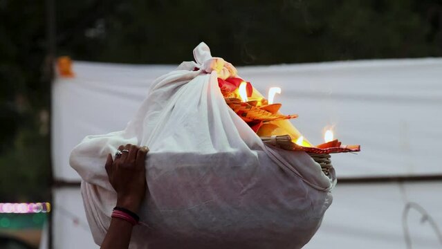 holy offerings of burning clay oil lamp for hindu sun god at chhath festival