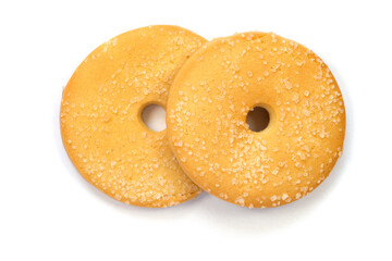 Two round cookies with a hole on a white background. Sweet shortbread cookies are isolated.