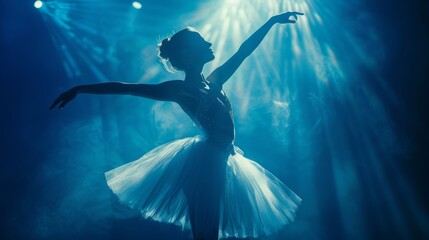 Ballerina dancing classical dance and performing against dark blue background