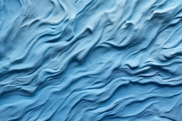 Relief empty blue plaster wall close-up.