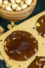 making homemade chocolate with cocoa butter and nuts