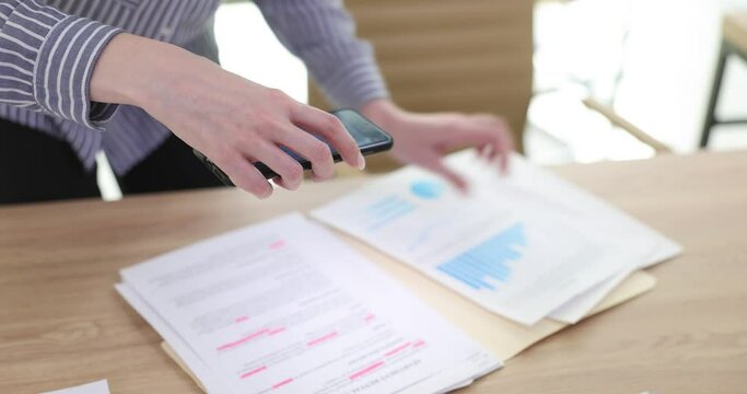 Manager using smartphone to scan documents
