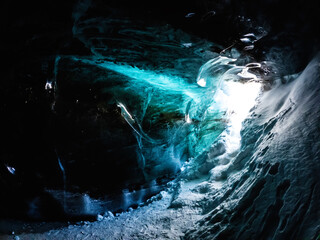 Glacial Grotto: A Frozen Marvel in the Tian Shan Mountains of Central Asia.