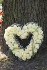 heart shaped sympathy flower arrangement, white roses