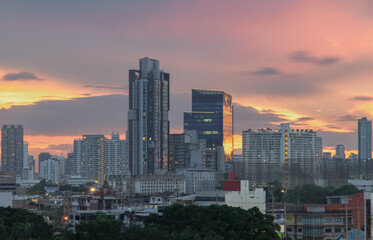 Bangkok city skyscrapers after sunset with Beautiful sky background. Gorgeous scenic of sunset with beautiful cloud and sky over metropolitan city, They can be used as Wallpaper, Space for text.