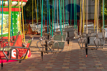 Empty and stable swing carousel chairs.