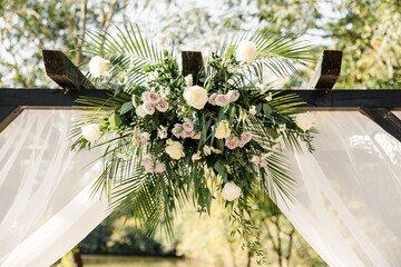 Close-up of wedding arch floral arrangement