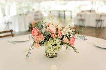 Beautiful wedding table centerpiece with a pastel floral arrangement