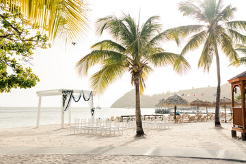 Tropical beach wedding setting in St Lucia with ocean backdrop
