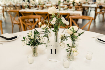 Reception table setting with numbered centerpiece