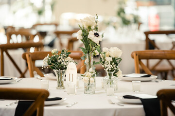 wedding reception table with white floral decor