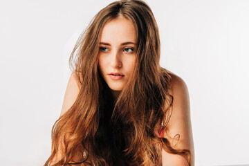Naklejka premium High key studio portrait of teen girl with long hair