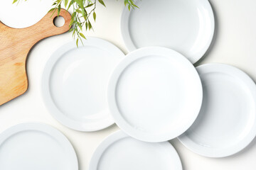 Set of white dinner plates on white background