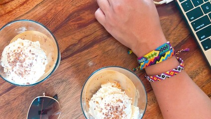 Colorful Bracelets with Affogatos on Wooden Table in Coffee Shop