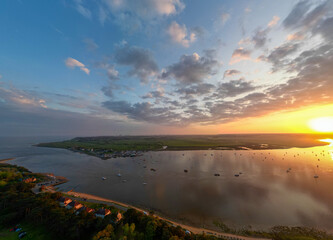 An aerial view of a spectacular sunset over the River Deben at Bawdsey Beach in Suffolk, UK