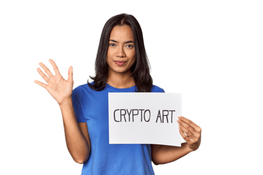 Woman with "crypto art" sign in studio smiling cheerful showing number five with fingers.