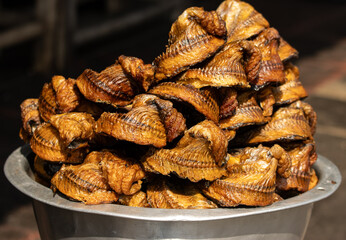 fried fish with bones as background.