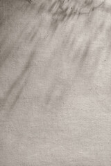 Aesthetic abstract sunlight shadows on soft neutral taupe beige linen cloth background, sustainable...