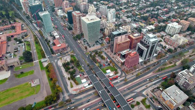 Aerial view establishing the Escuela Militar sector, affluent area of Santiago de Chile with the SCL Apoquindo building, main street of Las Condes.