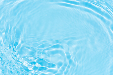 Blue water with ripples on the surface. Defocus blurred transparent blue colored clear calm water...