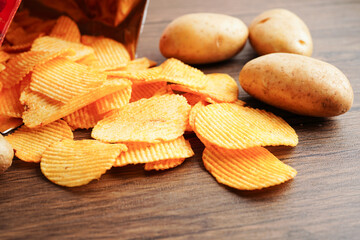 Potato chips in open bag, delicious BBQ seasoning spicy for crips, thin slice deep fried snack fast...