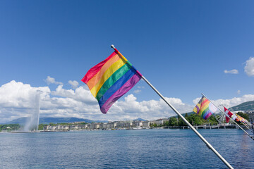 A six-band rainbow flag representing the LGBT community flutters in the wind on the Mont Blanc...