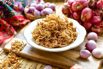 Crispy fried shallots on white bowl