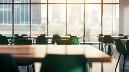 Green desk chairs around empty tables in urban classroom or corporate meeting space, Empty modern conference room interior concept with city skyline windows